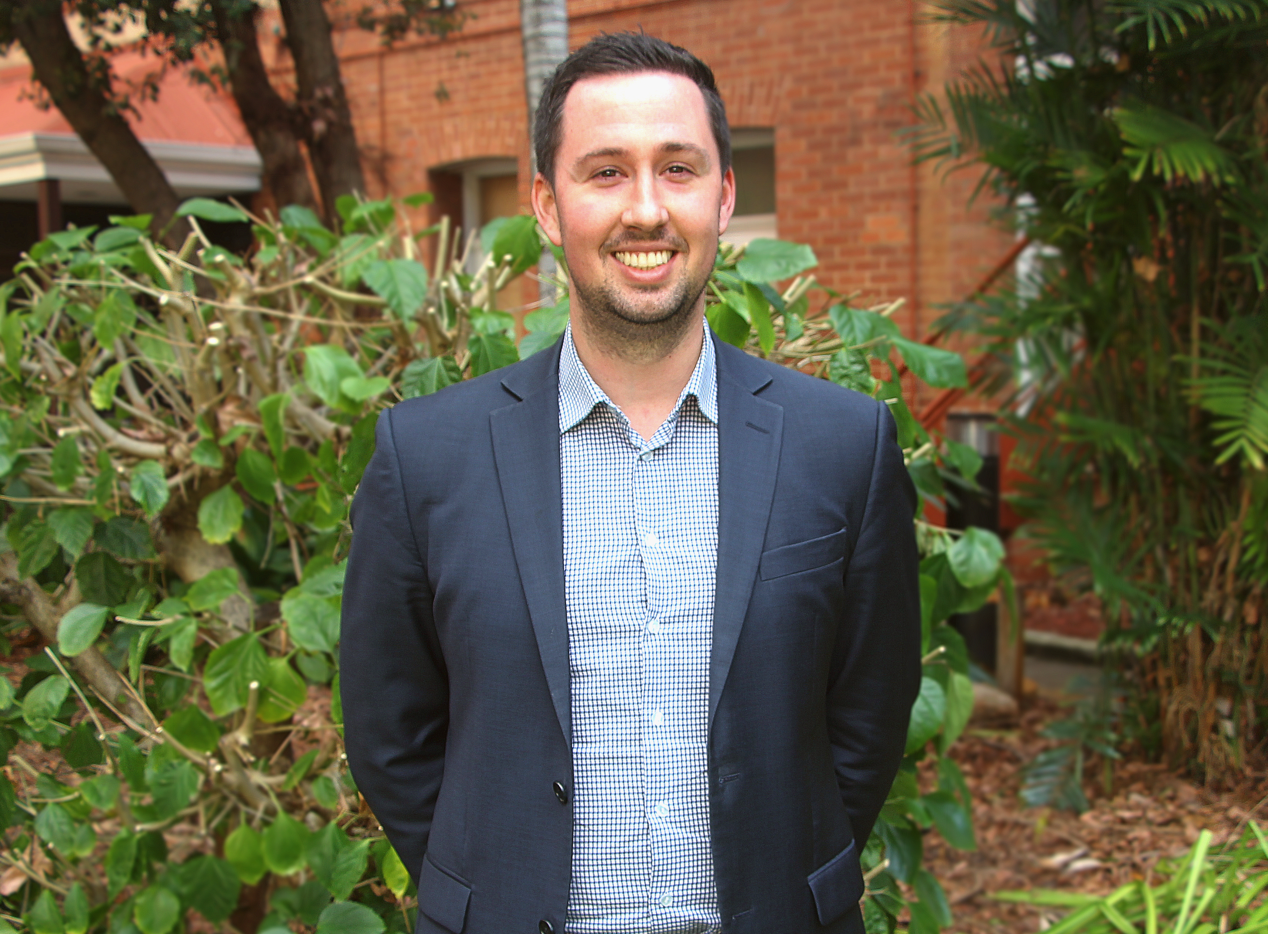 Alex Hayes, Engineer from HTMU standing in garden