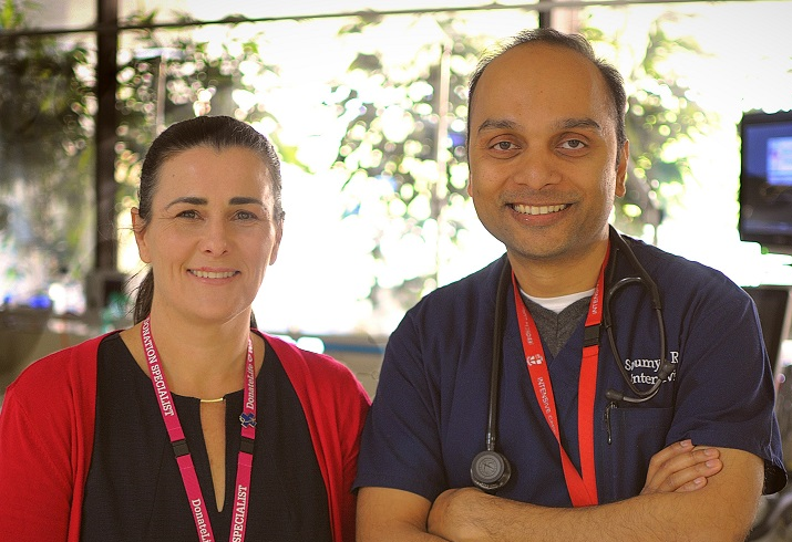 Photograph of two people standing side by side
