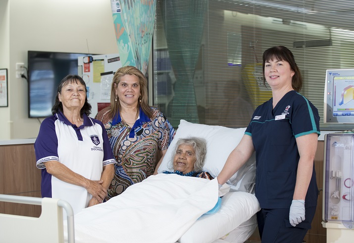 Photo of volunteers with patient